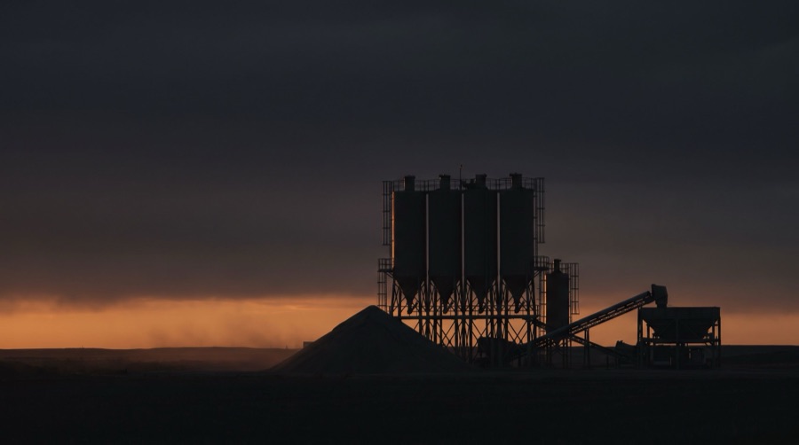 Frac sand transload silos at dusk